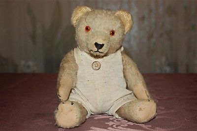 A German teddy bear 1910-1920s, with golden yellow mohair, closely